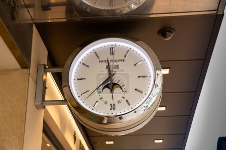 Photo for Hamburg, Germany - August 30, 2021 - Huge Pater Philippe clock hanging on the wall of Jeweler Wempe shop in Neuer Wall shopping street at Jungfernstieg underground station. - Royalty Free Image
