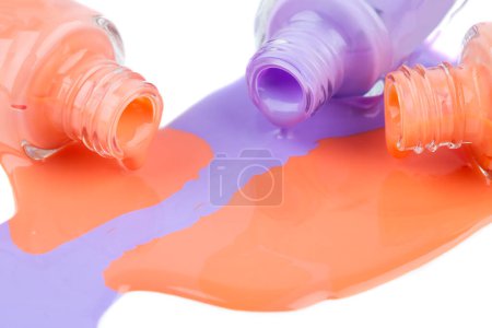 Photo for Spilled nail polishes on white background. - Royalty Free Image
