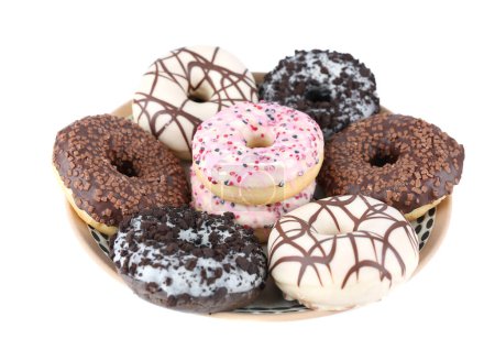 Foto de Muchos donuts de varios colores en la gran placa aislada sobre fondo blanco. - Imagen libre de derechos