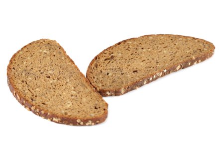 Foto de Rebanadas de pan con semillas de girasol y copos de avena aislados sobre fondo blanco. - Imagen libre de derechos
