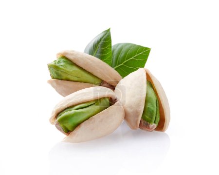 Photo for Pistachio nuts with leaves on white background - Royalty Free Image