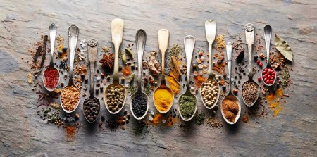 Photo for Mix spices in closeup on graphite board - Royalty Free Image
