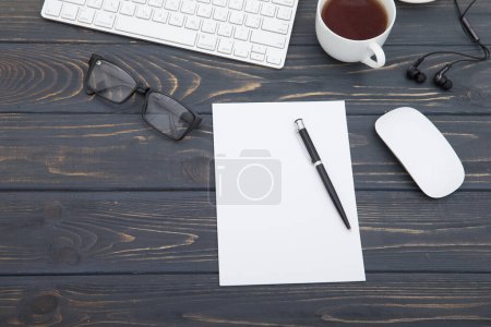 Photo for Workspace with tablet, keyboard, coffee cup and eyeglasses copy space on  background. Top view. - Royalty Free Image