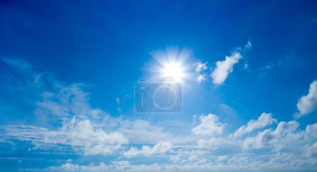 Photo for White fluffy clouds with rainbow in the blue sky - Royalty Free Image
