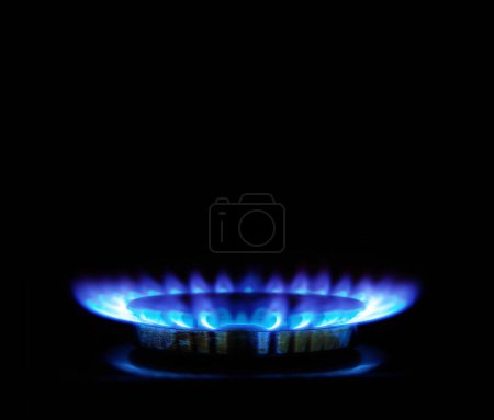 Photo for Flames of gas stove in the dark - Royalty Free Image