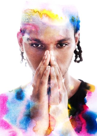 Photo for A black and white portrait of a young man with palms at his face combined with colorful watercolor pattern in paintography technique - Royalty Free Image