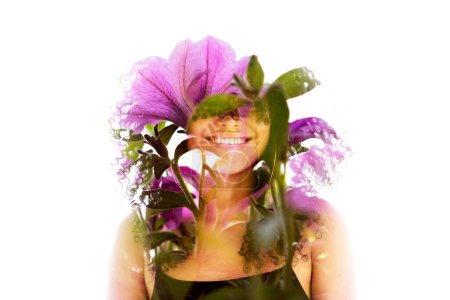 Photo for A portrait of a young smiling girl in full front combined with a photo of pink flowers in double exposure - Royalty Free Image