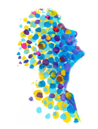 Foto de Una silueta de perfil combinada con una textura pointelle colorida en una doble exposición - Imagen libre de derechos