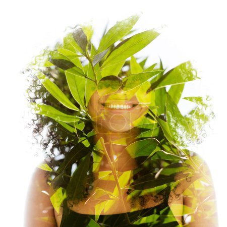 Photo for A portrait of a young smiling girl in full front combined with a photo of green leaves in double exposure, gradually disappearing into the white background - Royalty Free Image