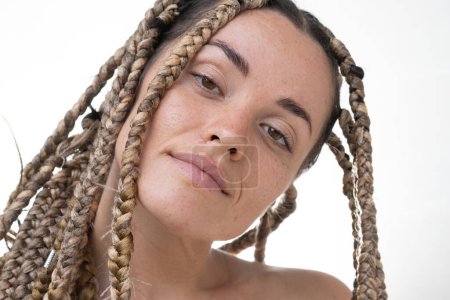 Photo for A closeup portrait of a young woman with dreadlocks half smiling - Royalty Free Image