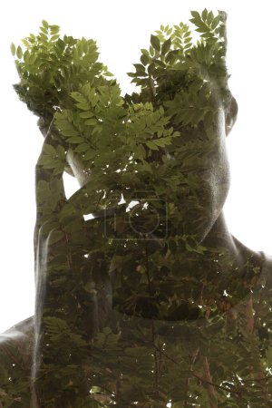 Foto de Una silueta de retrato de un hombre sosteniendo una mano en su cara combinada con una silueta de ramas de árbol con hojas de una manera artística sobre fondo blanco - Imagen libre de derechos