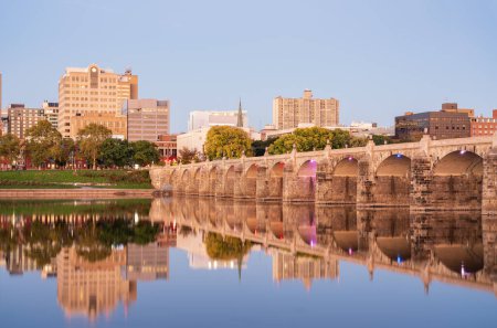 Reflections of the stone arches of the Market St Bridge in the Susquehanna river in Harrisburg PA