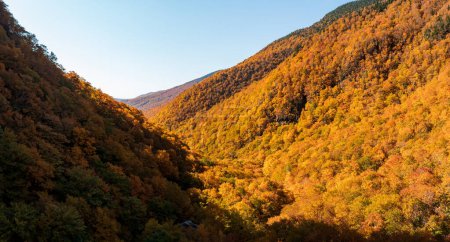Aerial panorama of Smugglers Notch looking towards Stowe in fall colors