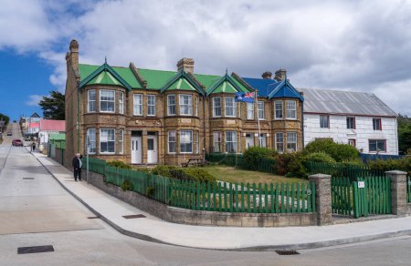 Photo for Port Stanley, Falkland Islands - 31 January 2023: Terrace of traditional Victorian homes with flag - Royalty Free Image