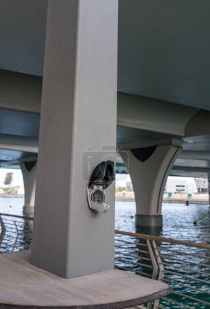 Photo for Charging point for USB devices and phones on the cycle track along the Dubai canal near Business Bay - Royalty Free Image