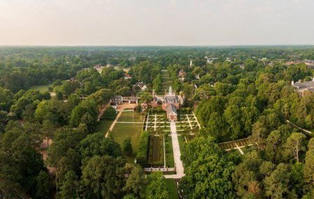 Photo for Drone view of rear facade and gardens of Governors Palace in Williamsburg Virginia at dawn - Royalty Free Image