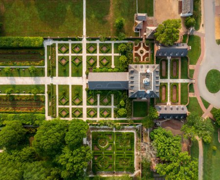 Photo for Drone top down view of roof and formal gardens of Governors Palace in Williamsburg Virginia at dawn - Royalty Free Image