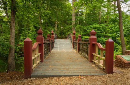 Photo for Ornate wooden bridge over Crim Dell on campus of William and Mary college in Williamsburg Virginia - Royalty Free Image