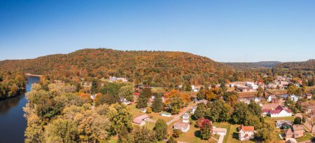 Photo for Aerial panorama of the small town of Confluence in Somerset County in Pennsylvania with fall colors on the leaves and trees - Royalty Free Image