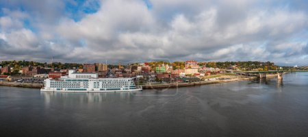 Photo for Burlington, IA - 19 October 2023: Aerial panorama of the city skyline with the Viking Mississippi docked on the waterfront in Iowa - Royalty Free Image