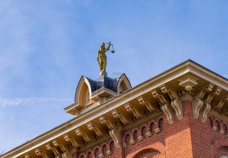 Lady Justice or Iustitia on the roof of the Delaware County Courthouse in Delaware, OH