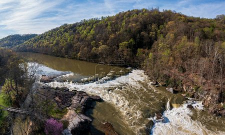 Aerial view of Valley Falls State Park near Fairmont in West Virginia on a spring day with redbud blossoms on the trees