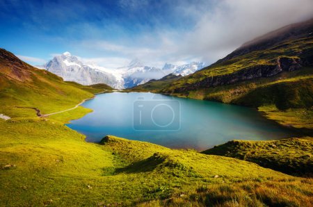 Photo for Panorama of Mt. Schreckhorn and Wetterhorn above Bachalpsee lake. Dramatic and picturesque scene. Popular tourist attraction. Location Swiss alps, Bernese Oberland, Grindelwald, Europe. Beauty world. - Royalty Free Image