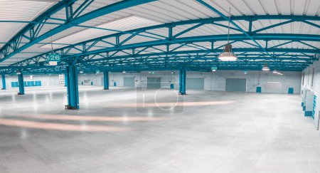 Photo for Interior of an empty modern warehouse with blue structures. fisheye. 3d render - Royalty Free Image