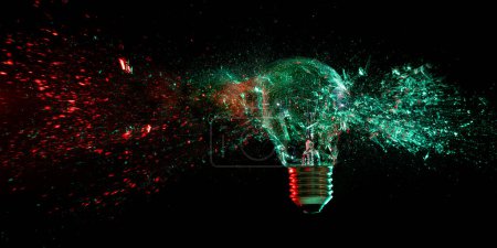 Photo for Light bulb shattering on black background - Royalty Free Image