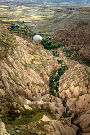 Photo for Goreme, Turkey -June 26 2022: flight of balloons over the valleys of Cappadocia - Royalty Free Image
