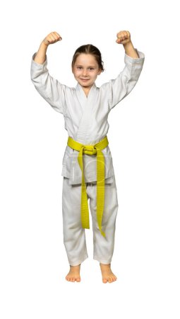 Photo for Child practising martial arts wearing a judogi, isolated on white - Royalty Free Image