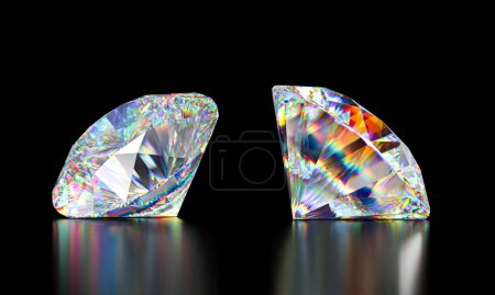 Téléchargez les photos : Deux diamants taille brillant affichant des couleurs spectrales flamboyantes isolés sur noir - en image libre de droit