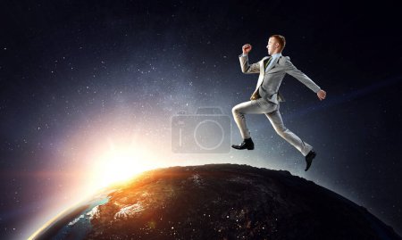 Foto de Retrato de empresario enérgico saltando al aire libre. Medios mixtos - Imagen libre de derechos