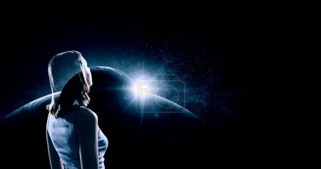 The universe within. Silhouette of a woman inside the universe. The concept on scientific and philosophical topics. Elements of this image furnished by NASA.