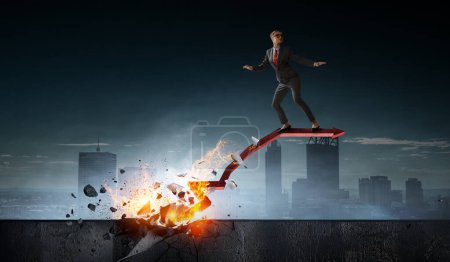 Foto de Decidido hombre de negocios dejando huellas de fuego en su camino hacia el éxito. Medios mixtos - Imagen libre de derechos