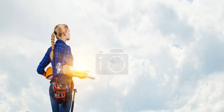 Photo for Female builder in the helmet standing - Royalty Free Image