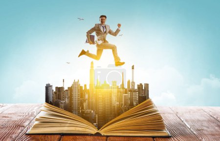 Photo for Businessman in suit running on top of a book. Mixed media. - Royalty Free Image