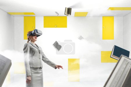 Photo for Woman wearing virtual reality goggles. Mixed media - Royalty Free Image