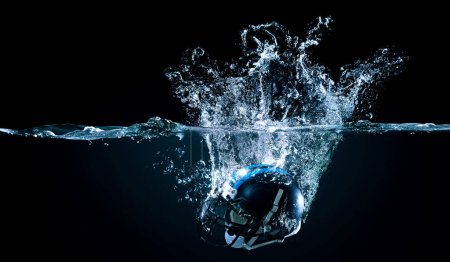 Photo for American football helmet in water. Mixed media - Royalty Free Image
