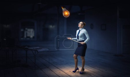 Photo for Businesswoman and light bulbs. Communication and innovation concept. Mixed media - Royalty Free Image