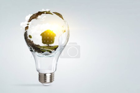 Photo for Green landscape inside light bulb. Mixed media - Royalty Free Image