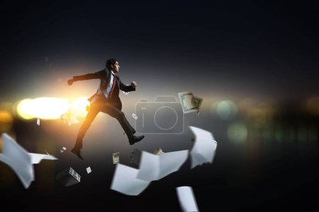 Photo for Portrait of energetic businessman running. Mixed media - Royalty Free Image