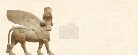Téléchargez les photos : Grunge background with stone texture and lamassu - human-headed winged bull. Horizontal banner with assyrian protective deity. Copy space for text. Mock up template - en image libre de droit