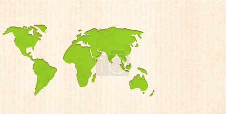 Ecology and zero waste concept. World map silhouette on cardboard texture. Horizontal banner with eco paper texture. Global ecological resource. Copy space for text. Mock up template