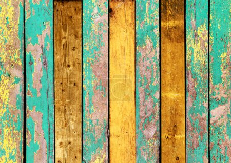 Foto de Textura de tableros de madera vintage con pintura agrietada de color amarillo y verde. Fondo retro horizontal con tablones de madera antiguos de diferentes colores - Imagen libre de derechos