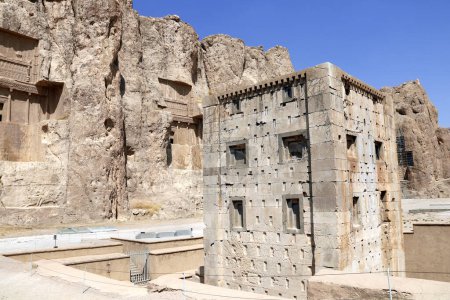 Photo for Royal tombs and Cube of Zoroaster (Ka'ba-ye Zartosht ) in ancient necropolis Naqsh-e Rustam, Achaemenid dynasty, Fars province, Iran. UNESCO world heritage site - Royalty Free Image