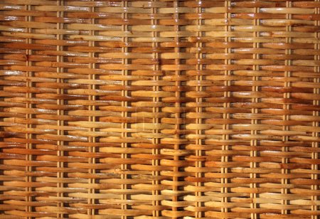 Photo for Texture of varnished wicker cane basket. Horizontal or vertical background with natural asian wicker mat material - Royalty Free Image