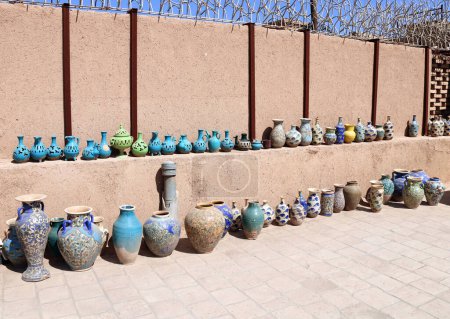 Photo for Traditional iranian souvenirs - colorful clay pots and jugs, Yazd, Iran - Royalty Free Image