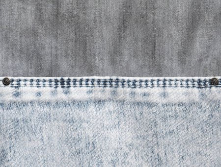 Photo for Grey and light grey  denim background with a seam. Light gray color denim jeans fabric texture. Copy space for text - Royalty Free Image