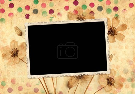 Photo for Retro background with photo frame and dry pressed leaf and flower. Nostalgic scrapbooking backdrop with old vintage photo and old paper texture with colorful polka dots pattern. Mockup template - Royalty Free Image